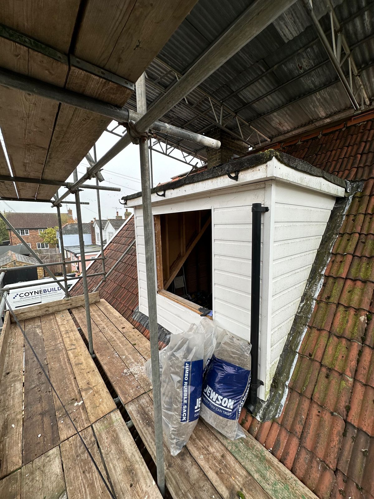 Dormer rebuild in progress up on the scaffold