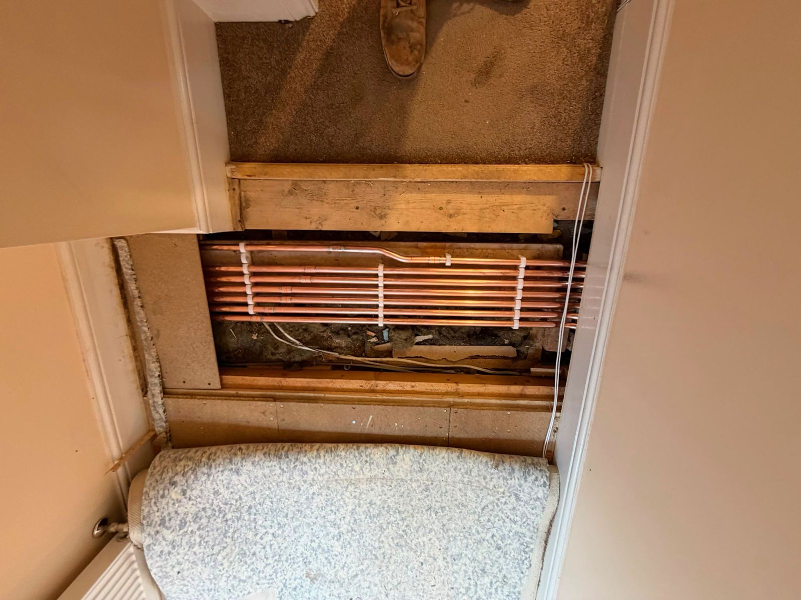 New copper heating runs neatly clipped and chased in